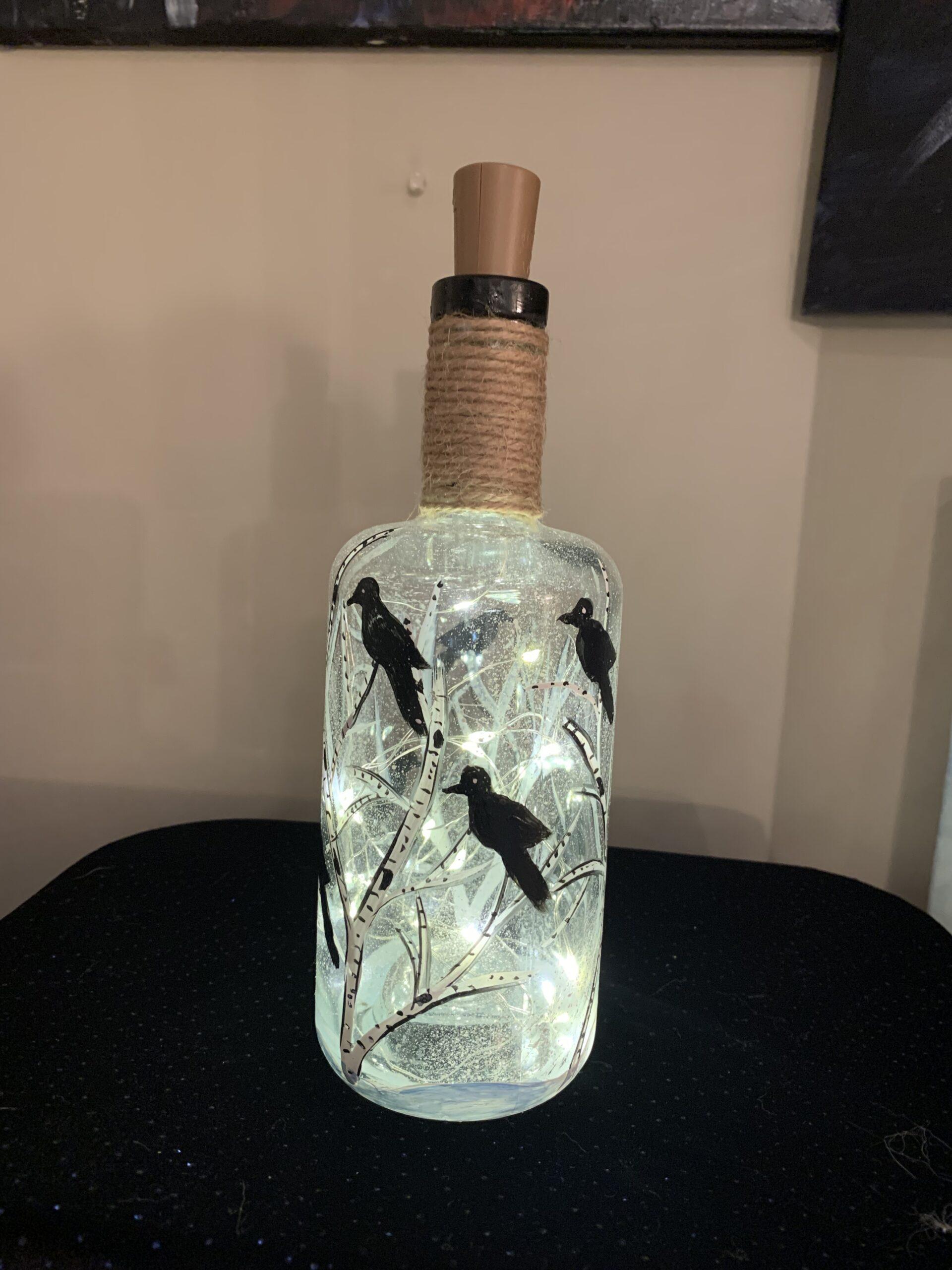 Lighted bottle with crows