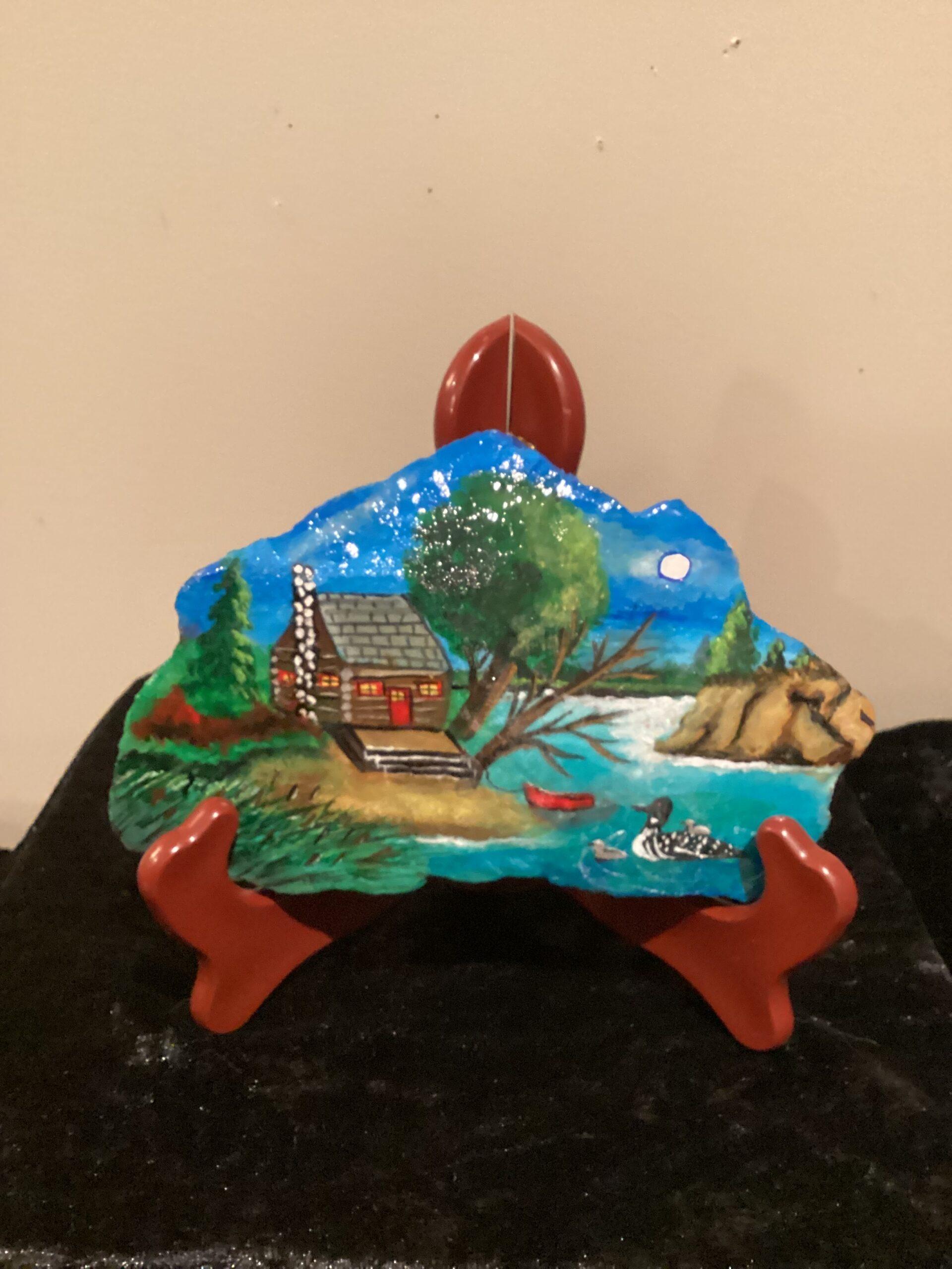 Hand painted cottage on rock.